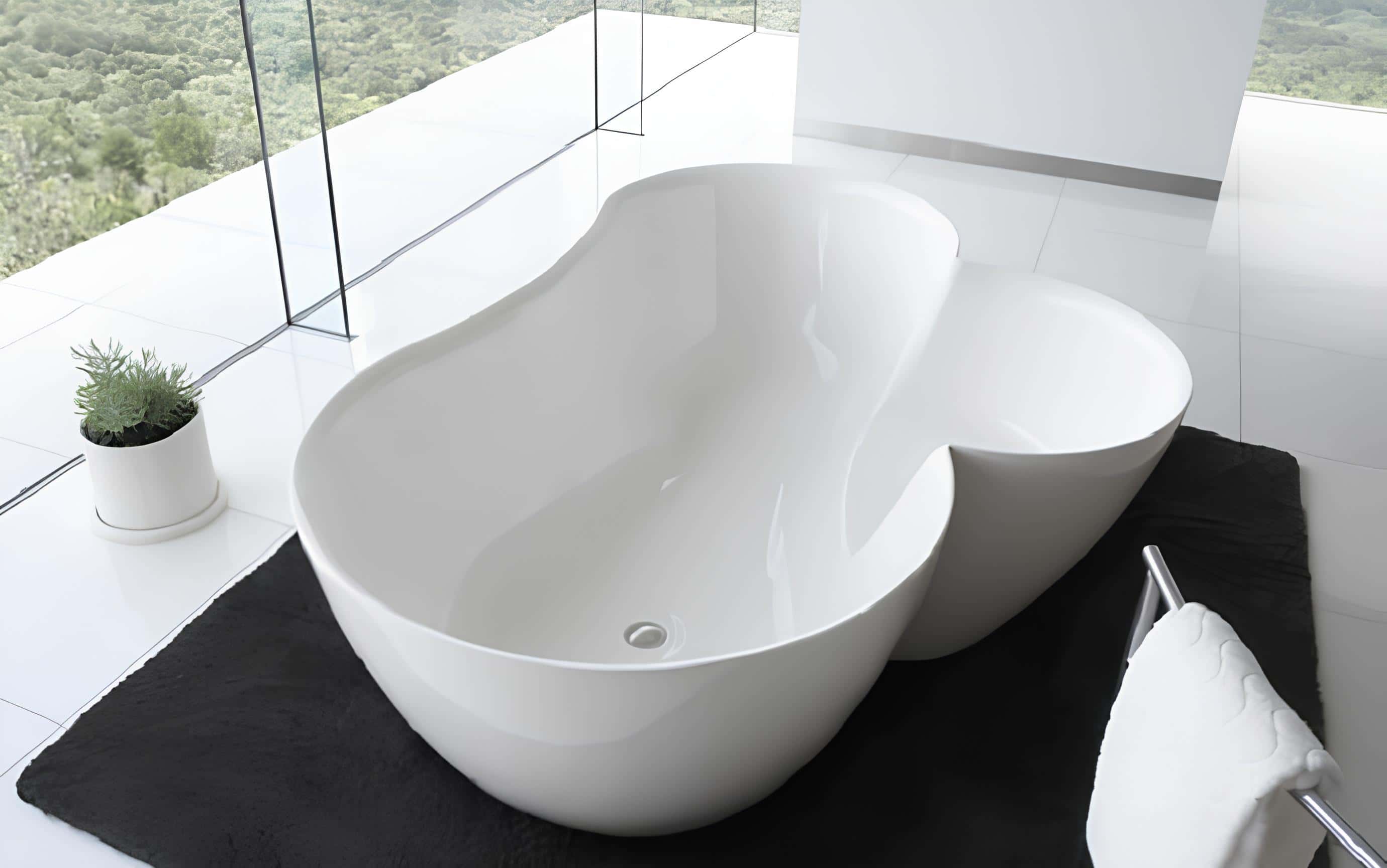 Organic Modern Bathtub with Nature View Modern sculpted bathtub with curved organic design overlooking lush greenery