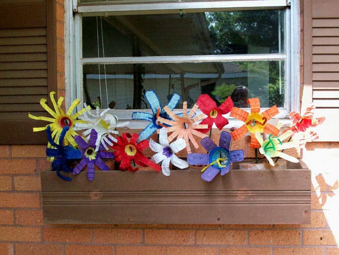 1. Create Charming Flower Decorations from Plastic Bottle Cutouts 1. Create Charming Flower Decorations from Plastic Bottle Cutouts