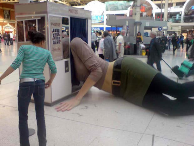 19. Giant Woman Lying in a Photo Booth, London, England 19. Giant Woman Lying in a Photo Booth, London, England