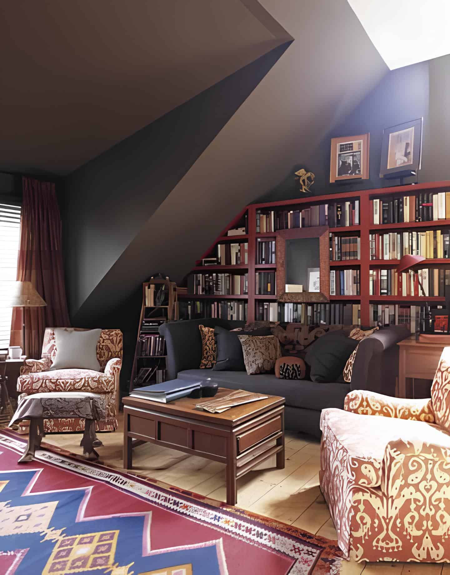 Attic home library with sloped ceiling, rich wood shelves and patterned rug