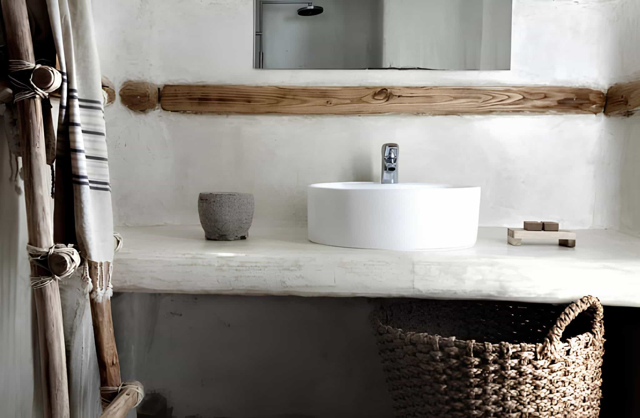 Boho Bathroom White Vanity Wicker Basket Bohemian style bathroom with a white vanity and a woven wicker basket.