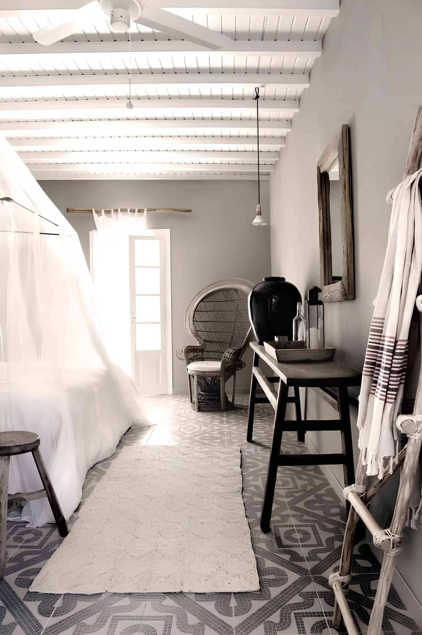 Canopy Bed Boho Room Patterned Floor Bohemian bedroom with canopy bed, ethnic floor tiles, and rustic furnishings.