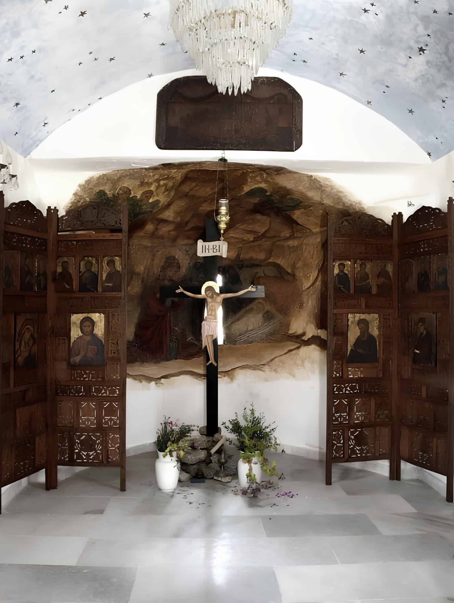 Chapel Interior Iconography and Crucifix Traditional chapel interior with wooden iconostasis and painted crucifix.