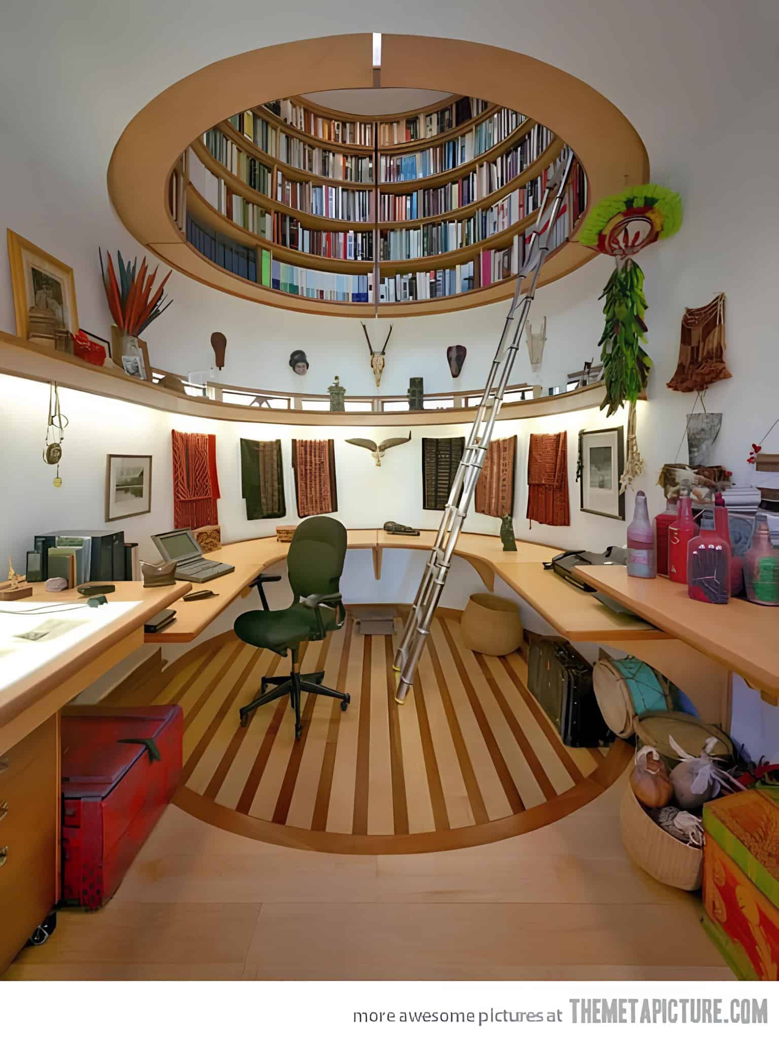 Circular library mezzanine over home office with ladder and built-in shelving
