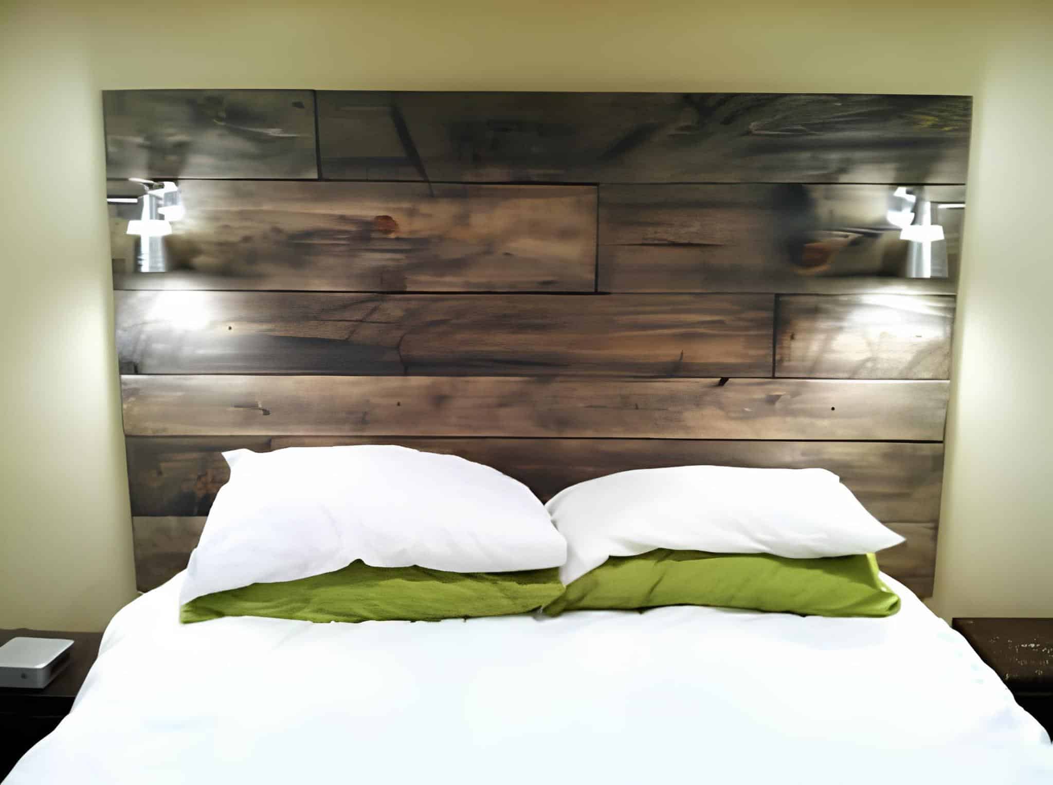 Modern rustic headboard made from wide dark wood planks
