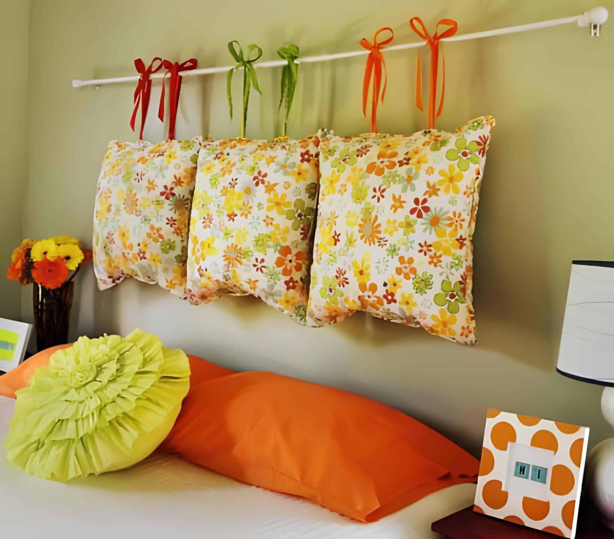 Colorful floral pillows tied with ribbons create a cheerful headboard