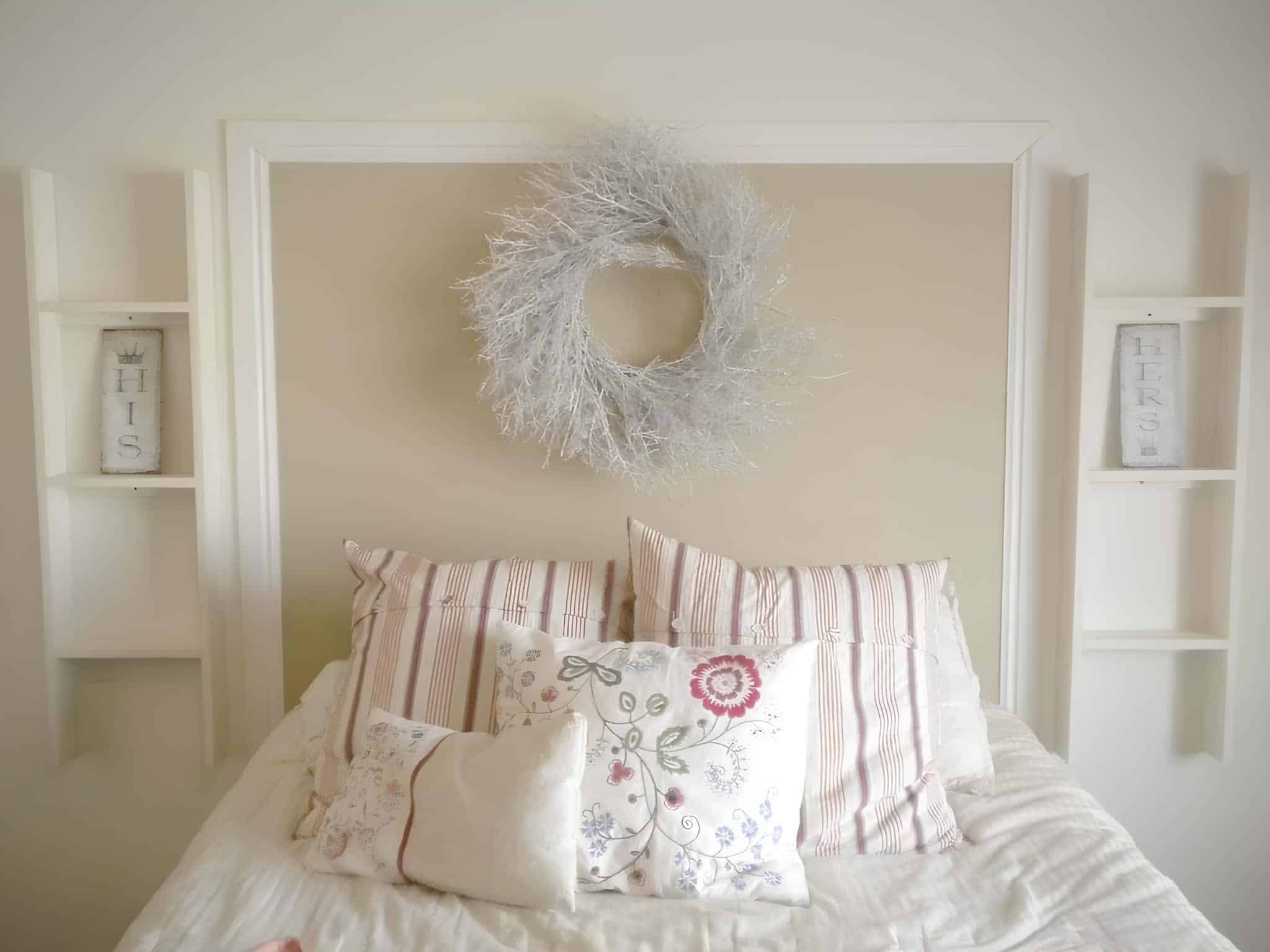 Minimalist white bedroom with striped pillows and His & Hers decor
