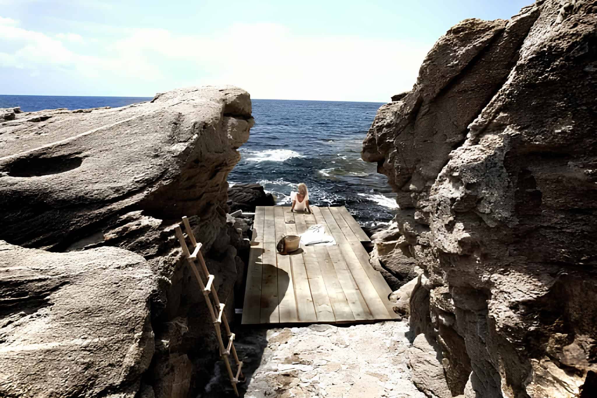 Private Rocky Seaside Deck Secluded wooden platform nestled between rocks with direct sea view.