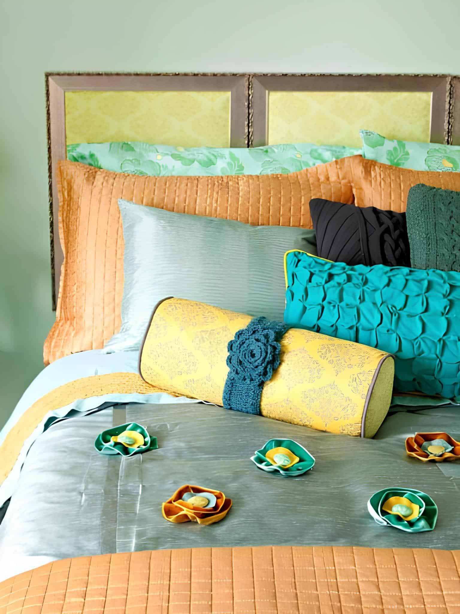 Colorful bedding with a mix of turquoise, orange, and yellow accents