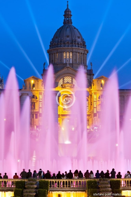 This spectacular, pink illuminated water feature is the Font Magica de Montjuic in Barcelona, Spain.