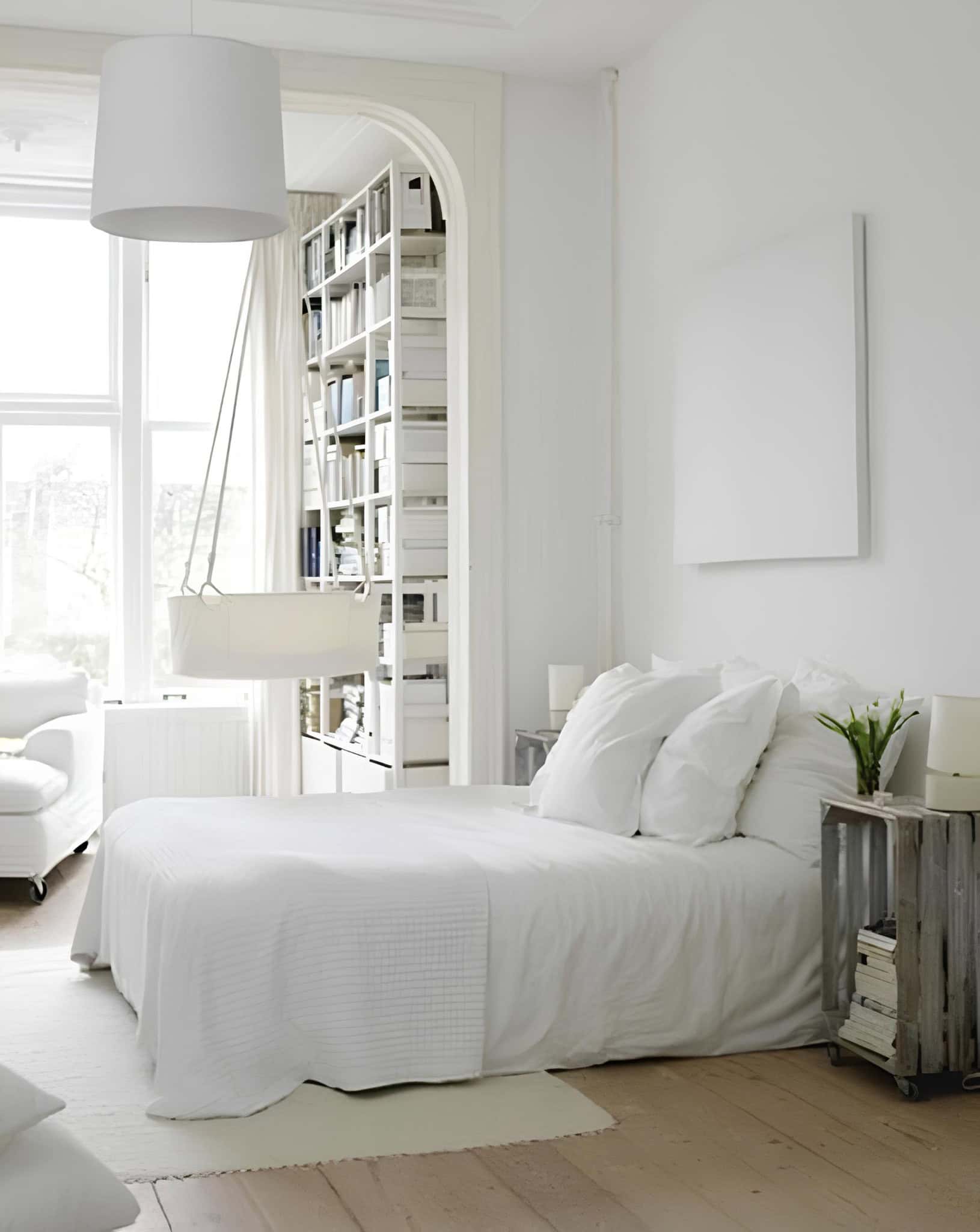 Modern White Bedroom with Arched Bookshelf Contemporary white bedroom with arched opening and built-in bookshelf