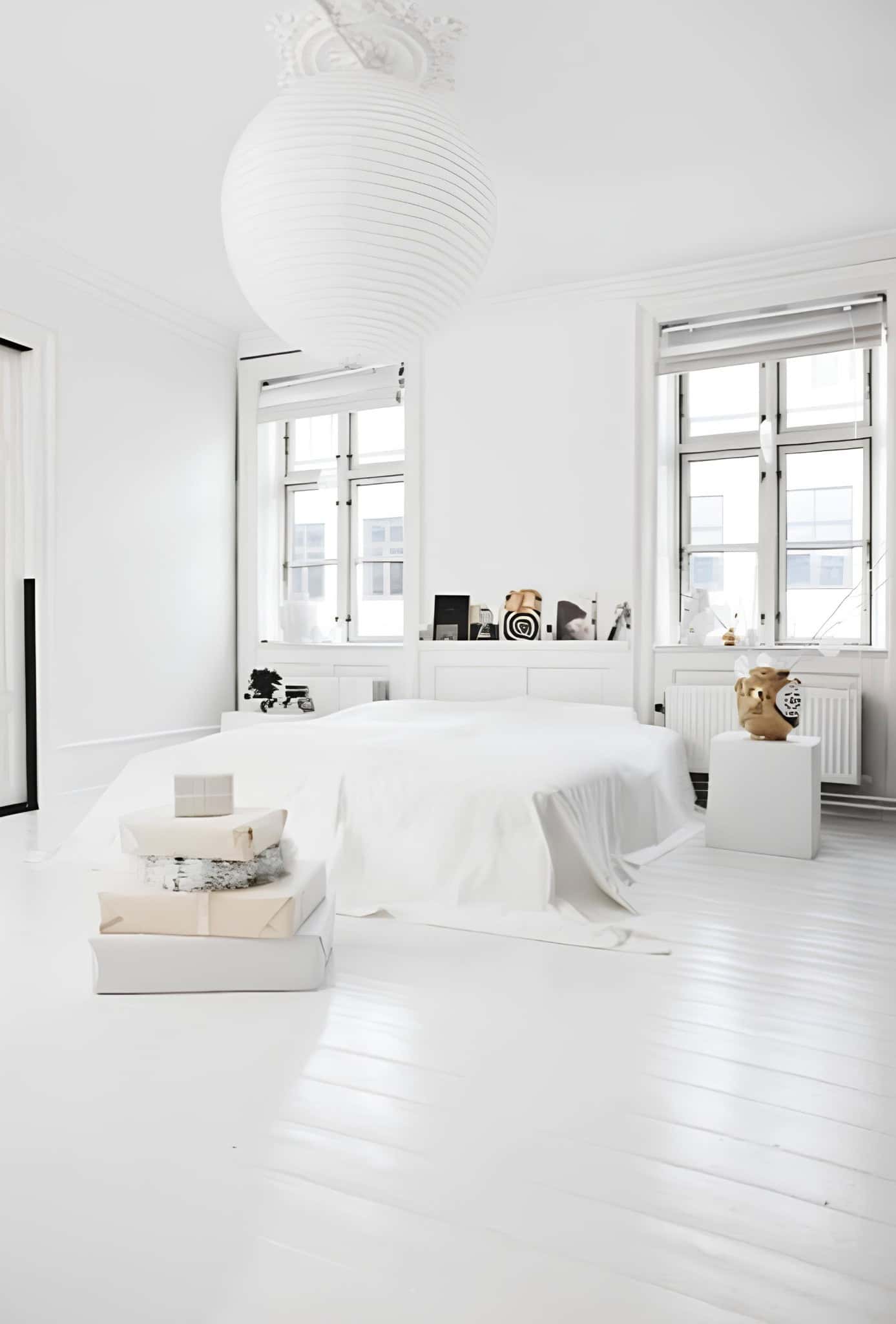 Ultra White Bedroom with Modern Minimal Style Minimal white bedroom with low platform bed, large paper lantern and modern decor