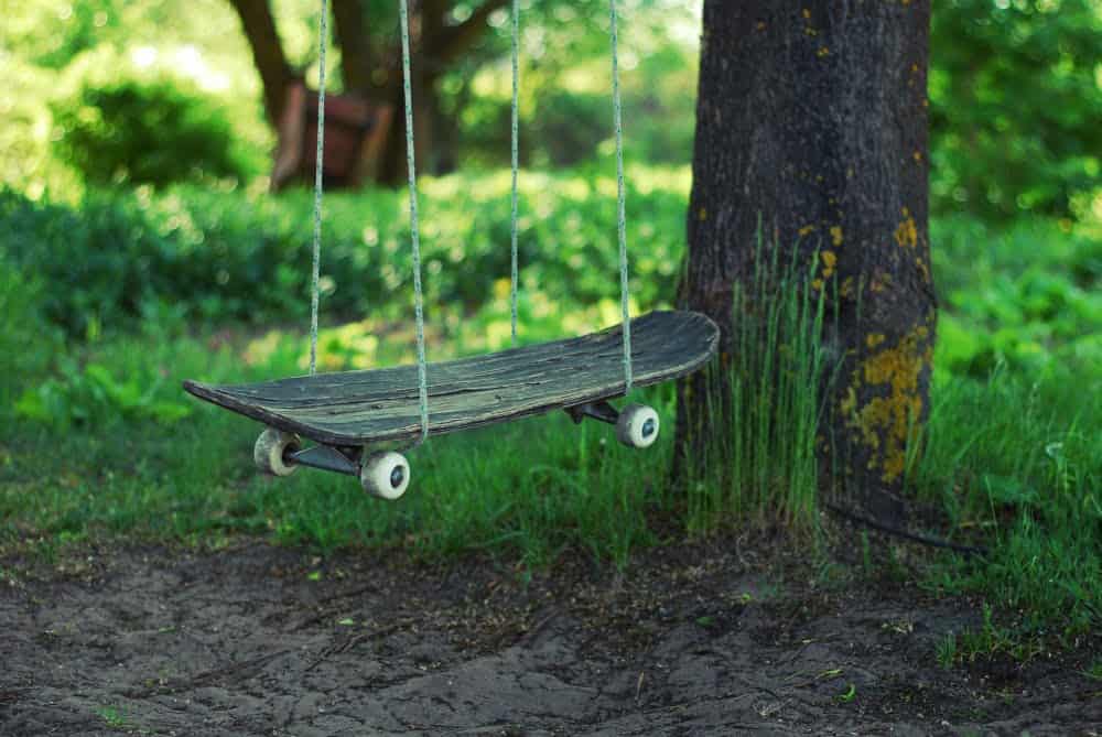 9. Cool idea. Use your old skateboard for a swing. 5c1df43f