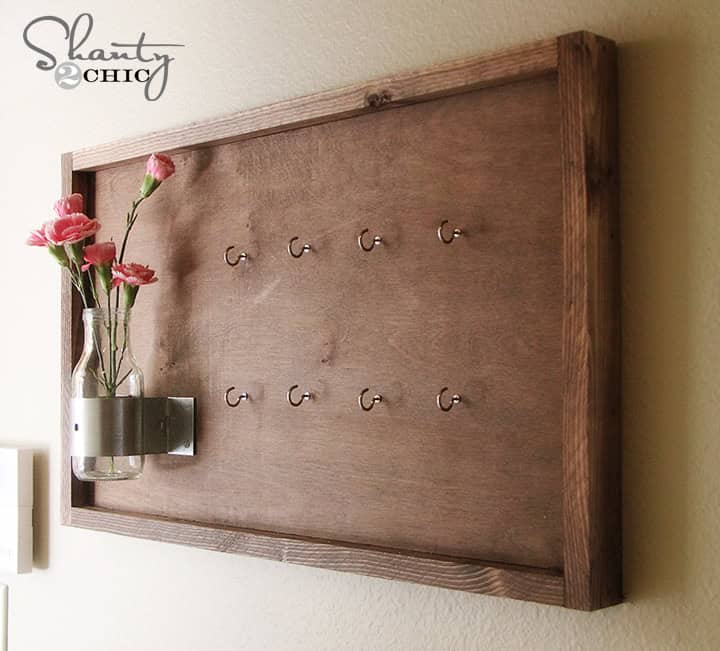 10. Decorate old wooden board with vase and flowers. Really cute key holders… 10