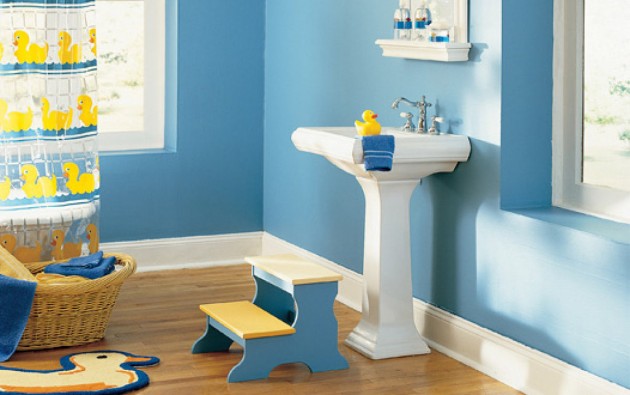 Blue and yellow colorful kids bathroom design. Blue walls with yellow accents.