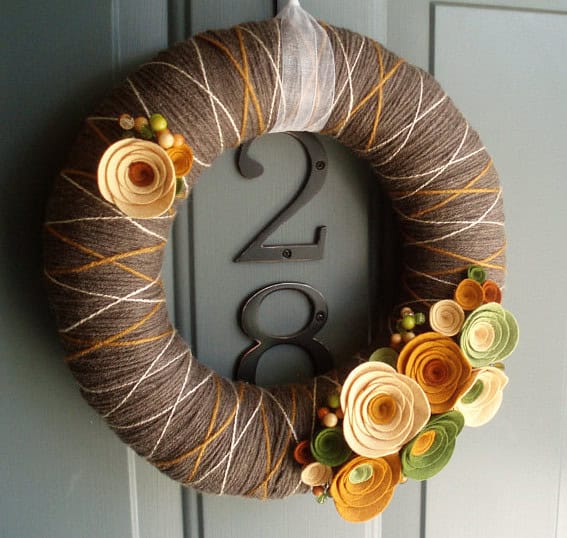 Handmade wreath with pumpkins, berries and leaves