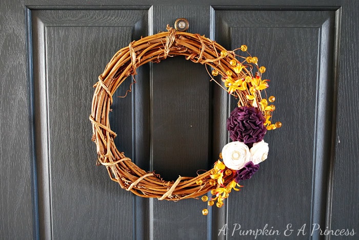 Colorful door wreath with autumn foliage