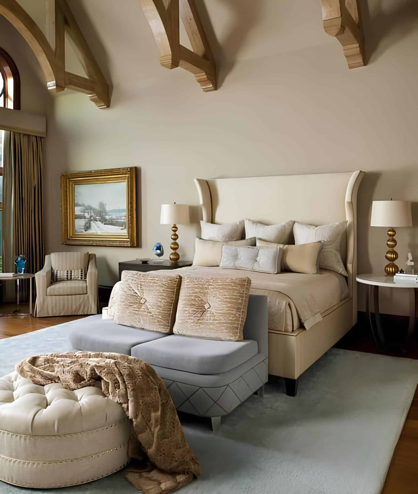 Spacious bedroom with vaulted ceiling and wooden beams, soft tones