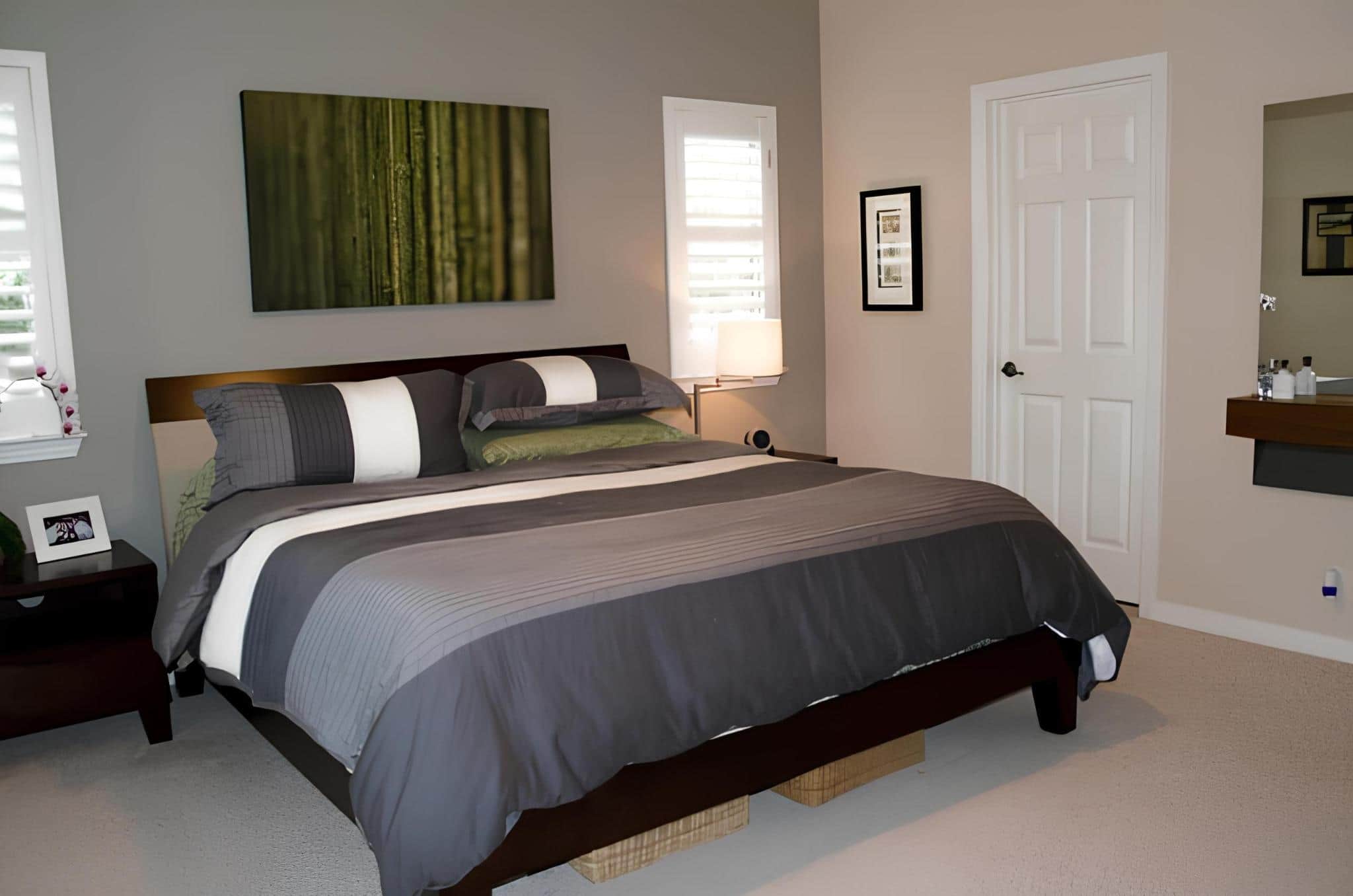 Clean minimalist bedroom with gray and white striped bedding