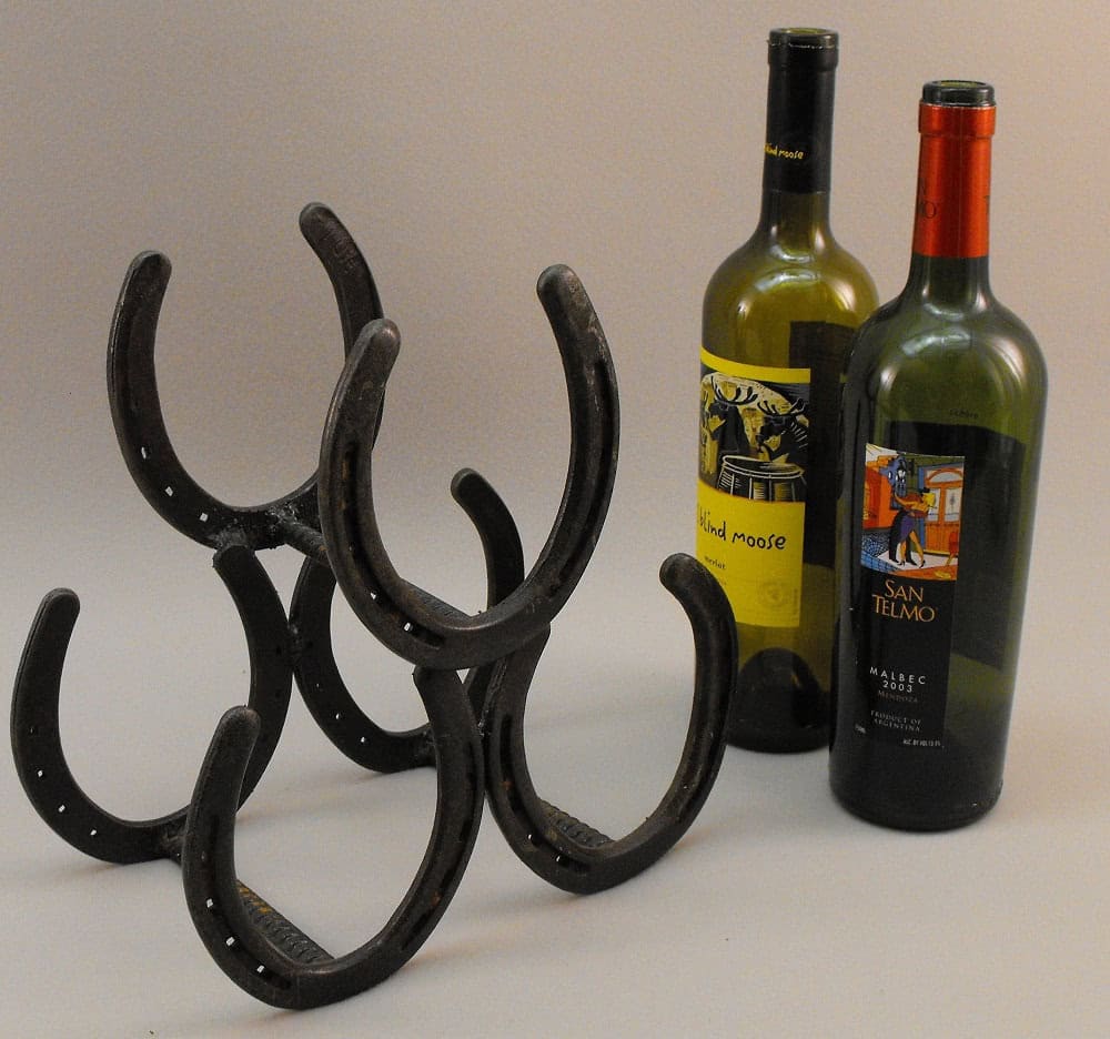 Metal wine rack made from horse shoes Buy it here: www.etsy.com