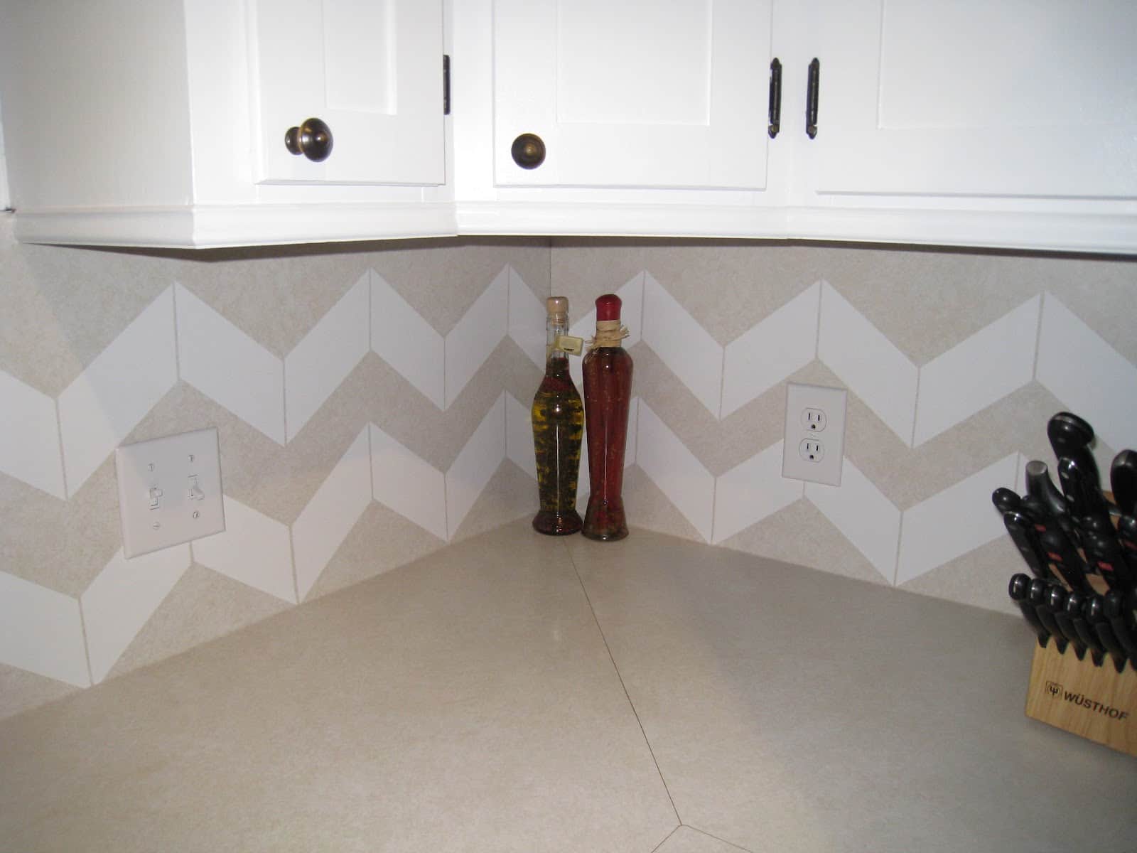 26. If you use a chevron pattern for your backsplash, you can get a nice streamlined look 26