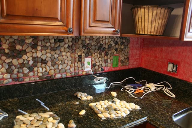 4. Gather a bunch of stones from your garden and use them to create yourself a backsplash 4