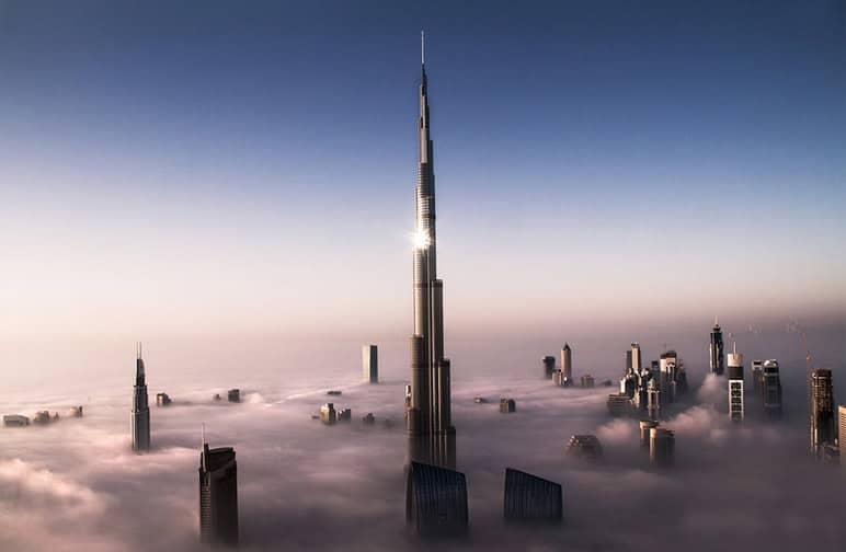 Skyline of Dubai far above the clouds Photo by: Bjoem Lauen