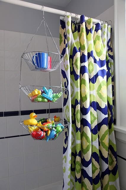 Use a hanging tiered fruit basket to hold bath toys 13