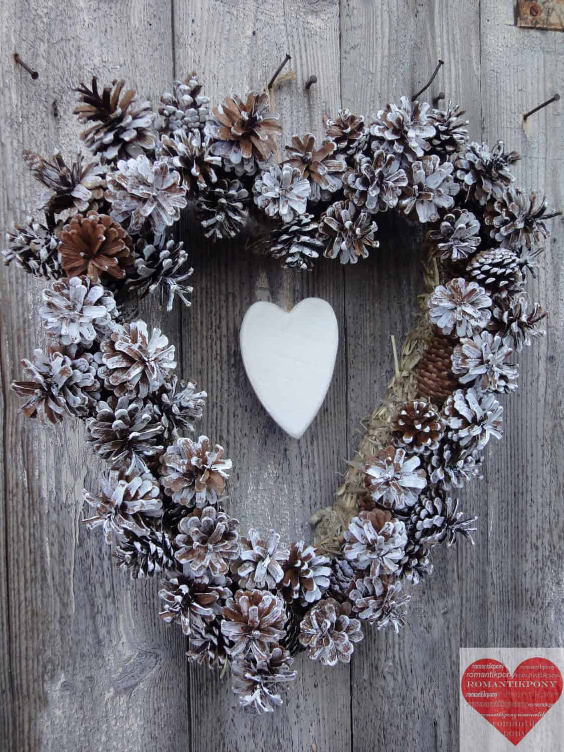 Heart shaped pine cone Christmas wreath Source