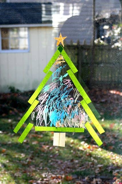 Use Crayola window markers, colored tissue paper and scotch tape to make a full size Christmas tree on the window Source