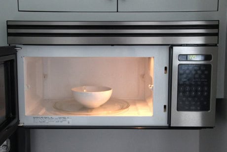 Steam clean your microwave with a bowl of vinegar 16