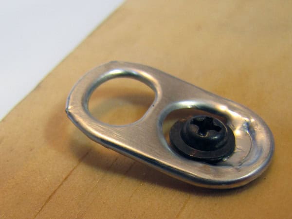 Hang a picture using a pop tab 2