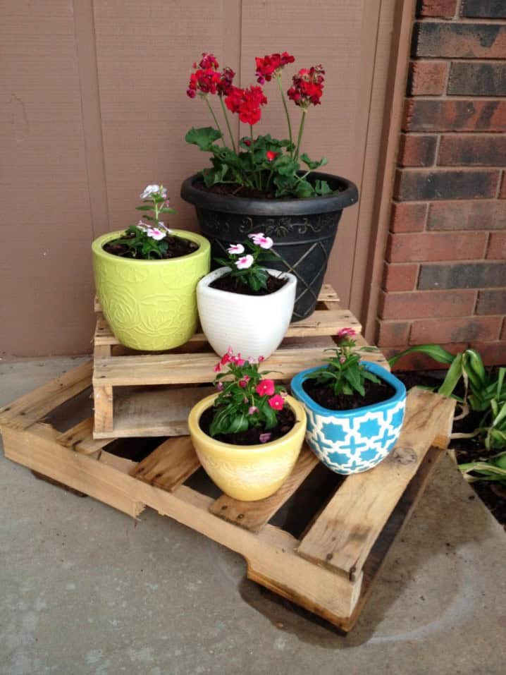 Stacked pallets and decorative flower pots 7
