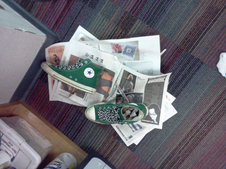 Drying wet shoes with newspapers 7