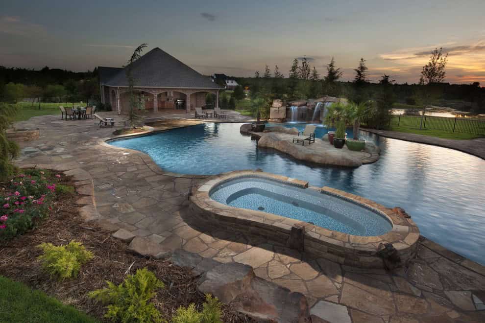 Glass Tiled Pool With A Tropical Island Oasis in Oklahoma Source