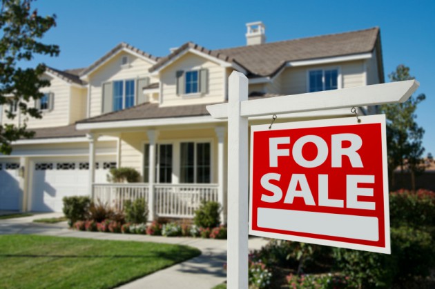 Home For Sale Sign in Front of New House.