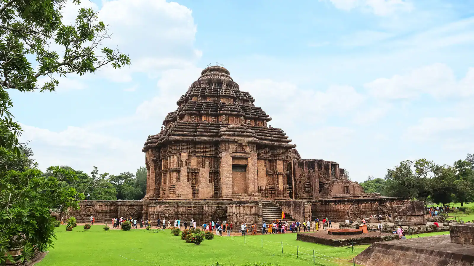 The Konark Sun Temple in Odisha, India — stone chariot with carved wheels and horses, ornate relief sculpture