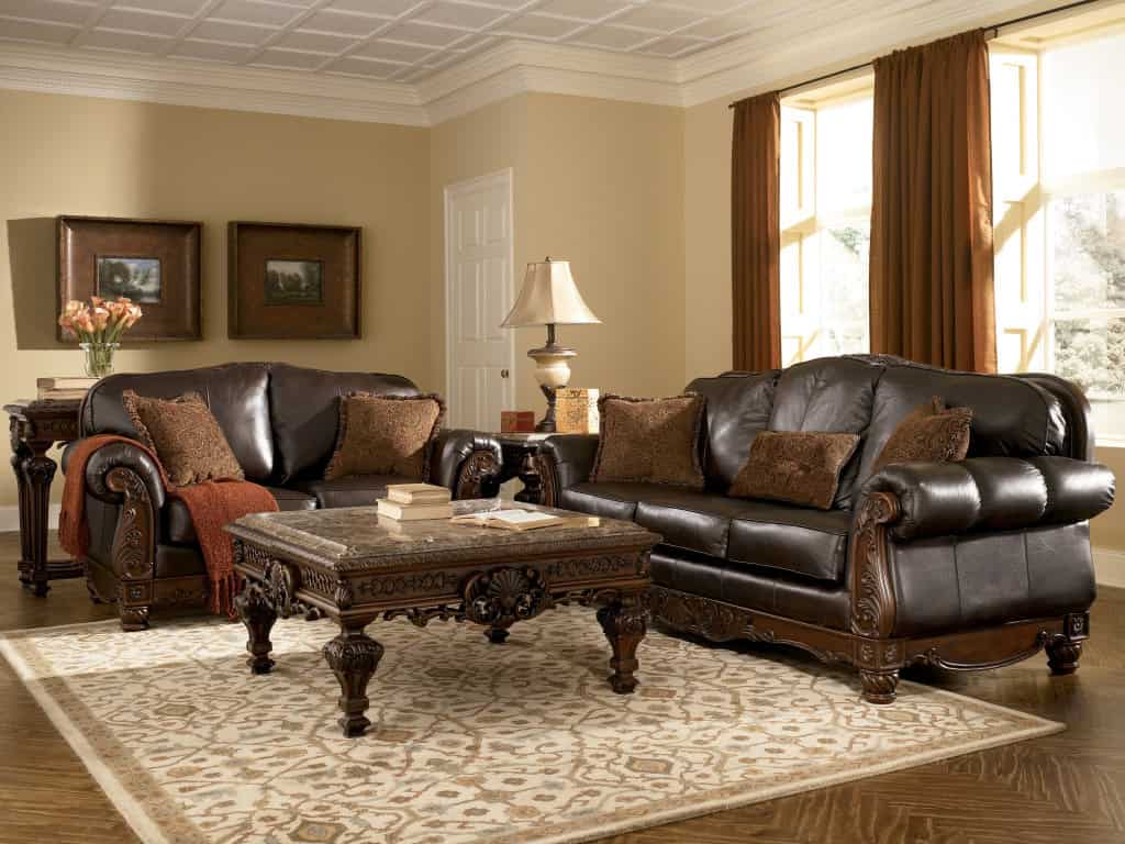 living room with dark leather furniture