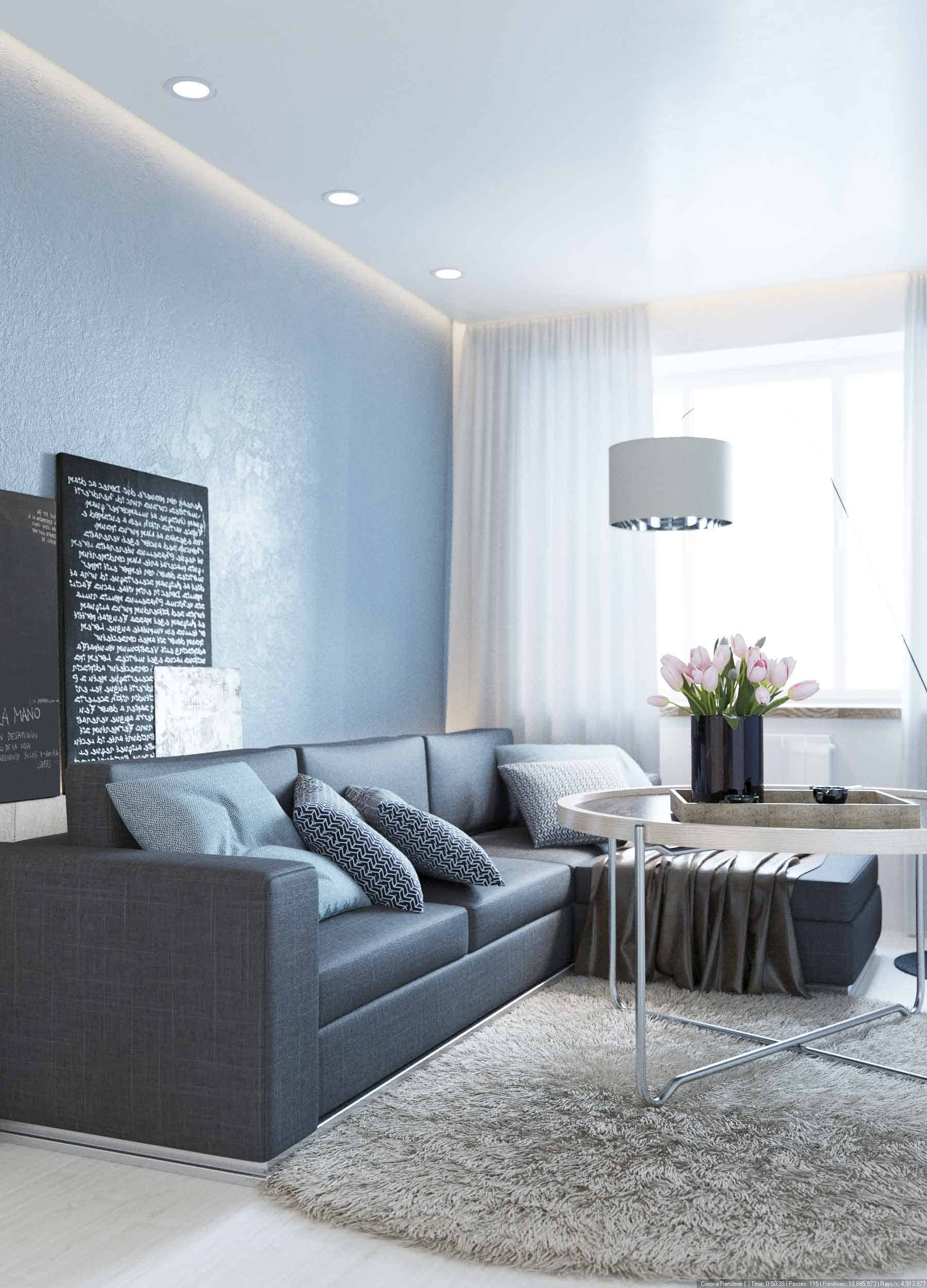 Modern minimalist living room with grey sofa, decorative pillows, round coffee table, and contemporary lighting, featuring sleek interior design and cozy ambiance.