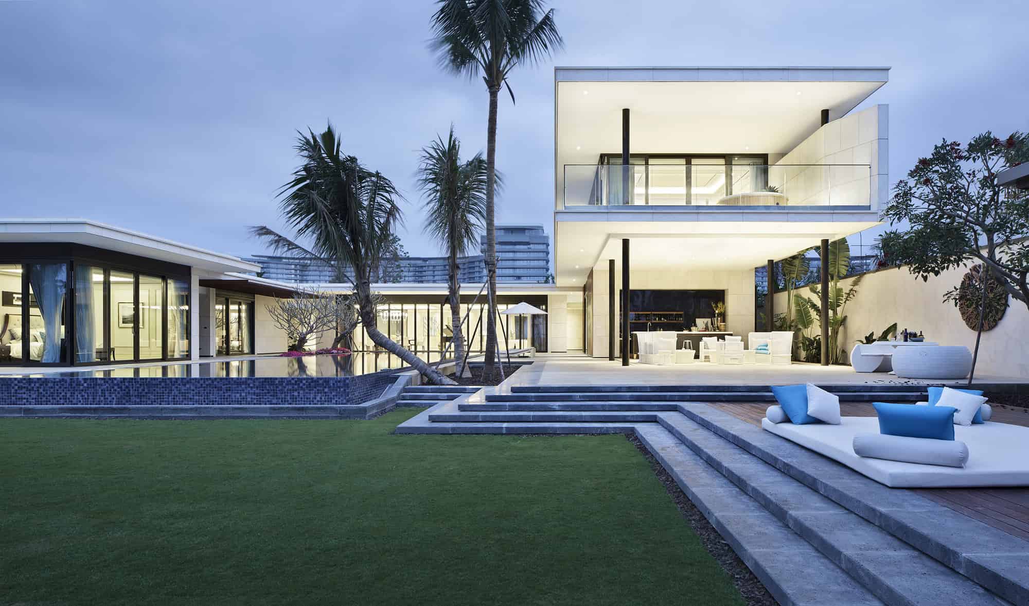 Luxurious modern house with open-concept design, outdoor pool, and contemporary architectural style showcasing sleek lines and minimalist aesthetics.