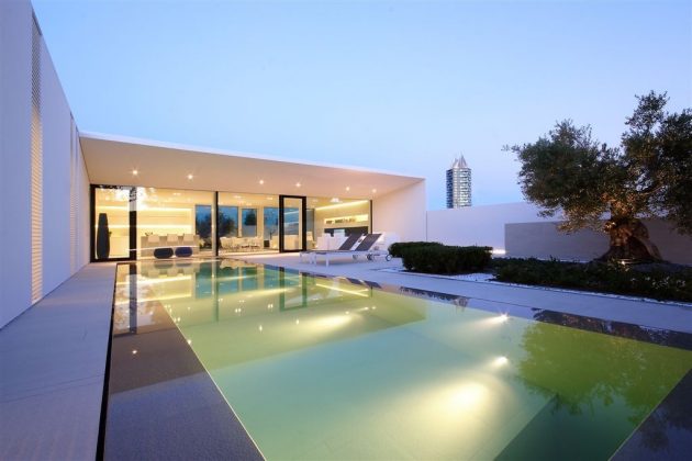 The Jesolo Lido Pool Villa by JM Architecture in Italy