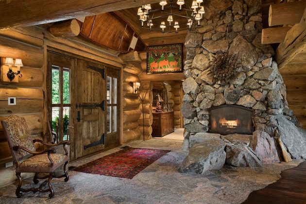 Interior, horizontal, foyer with fireplace, canoe hanging over entry, Goldberg residence, Lakeside, Michigan; Cannon Frank Interiors