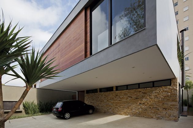 The cantilevered volume covers the garage area