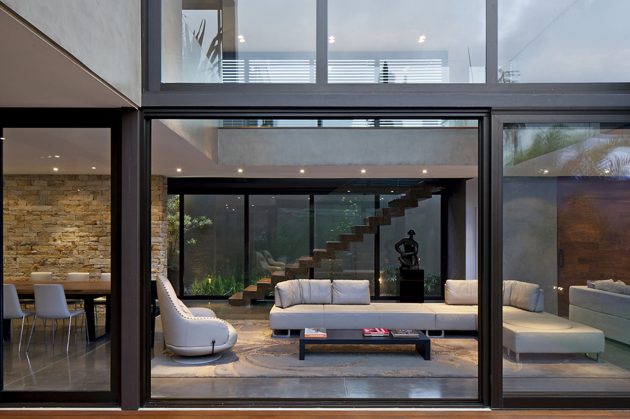 View of the double-height living room from the courtyard