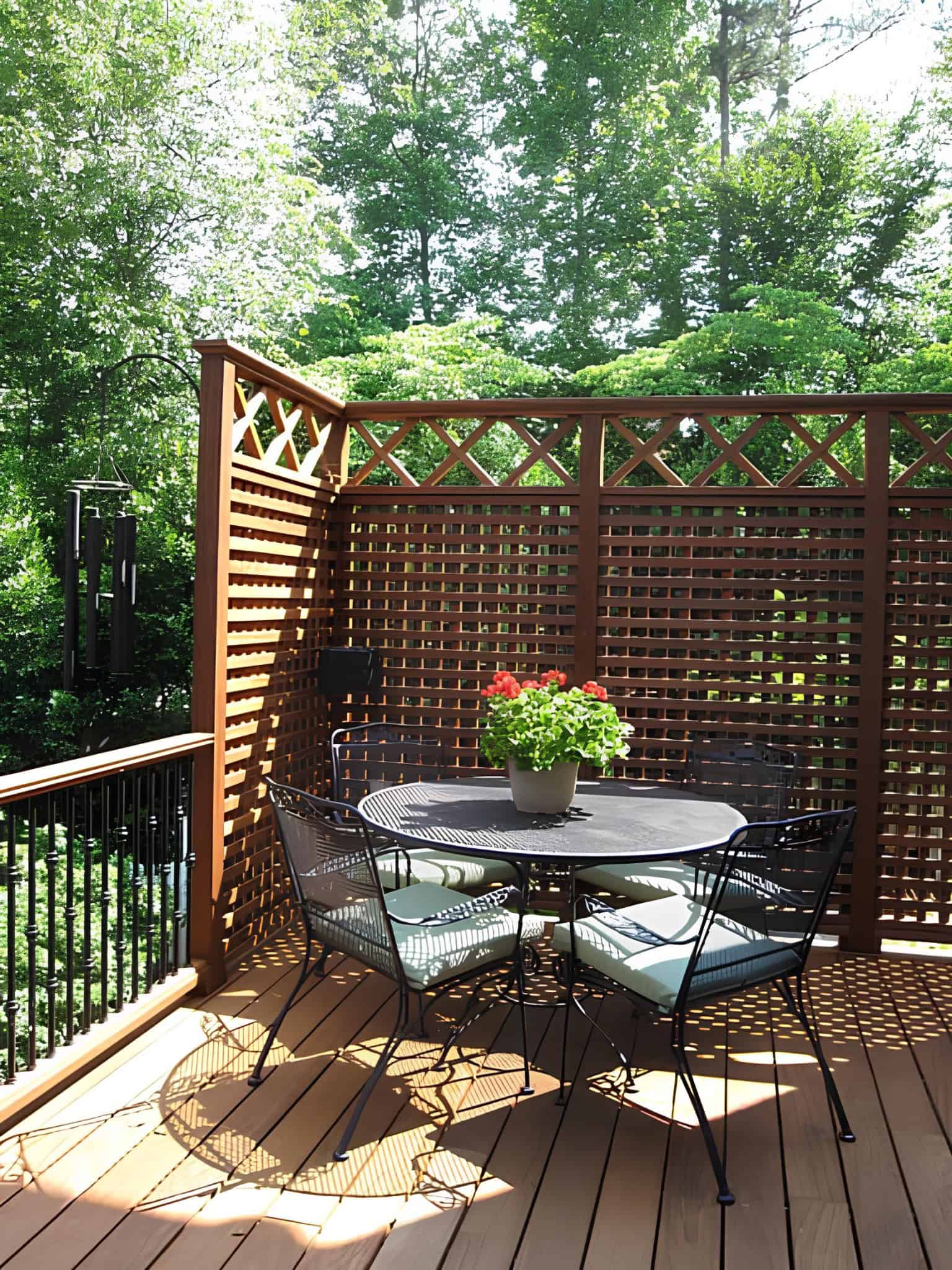 Lattice privacy wall on a deck corner with dining furniture