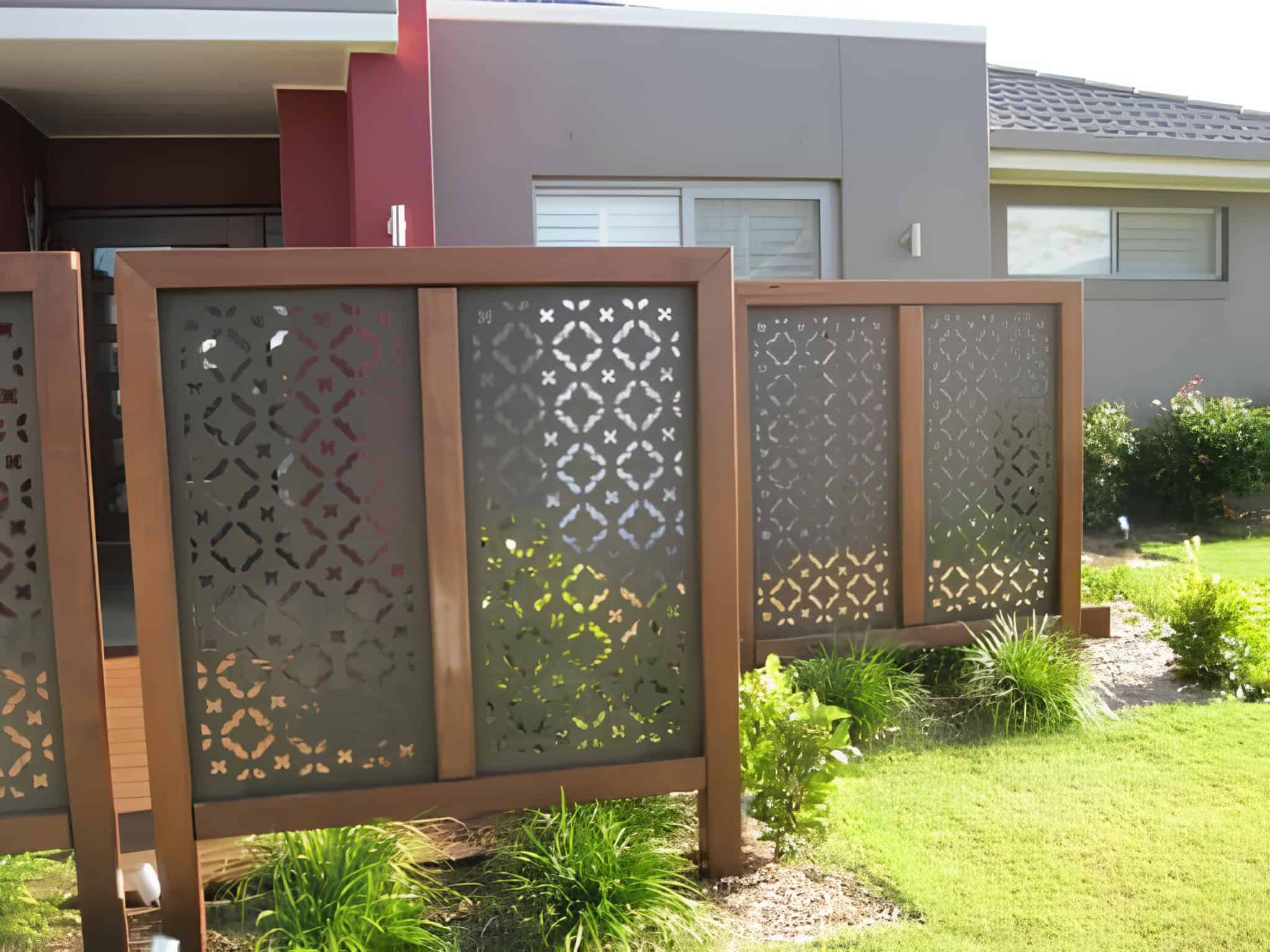 Modern patterned metal panels as decorative privacy screens for a front yard