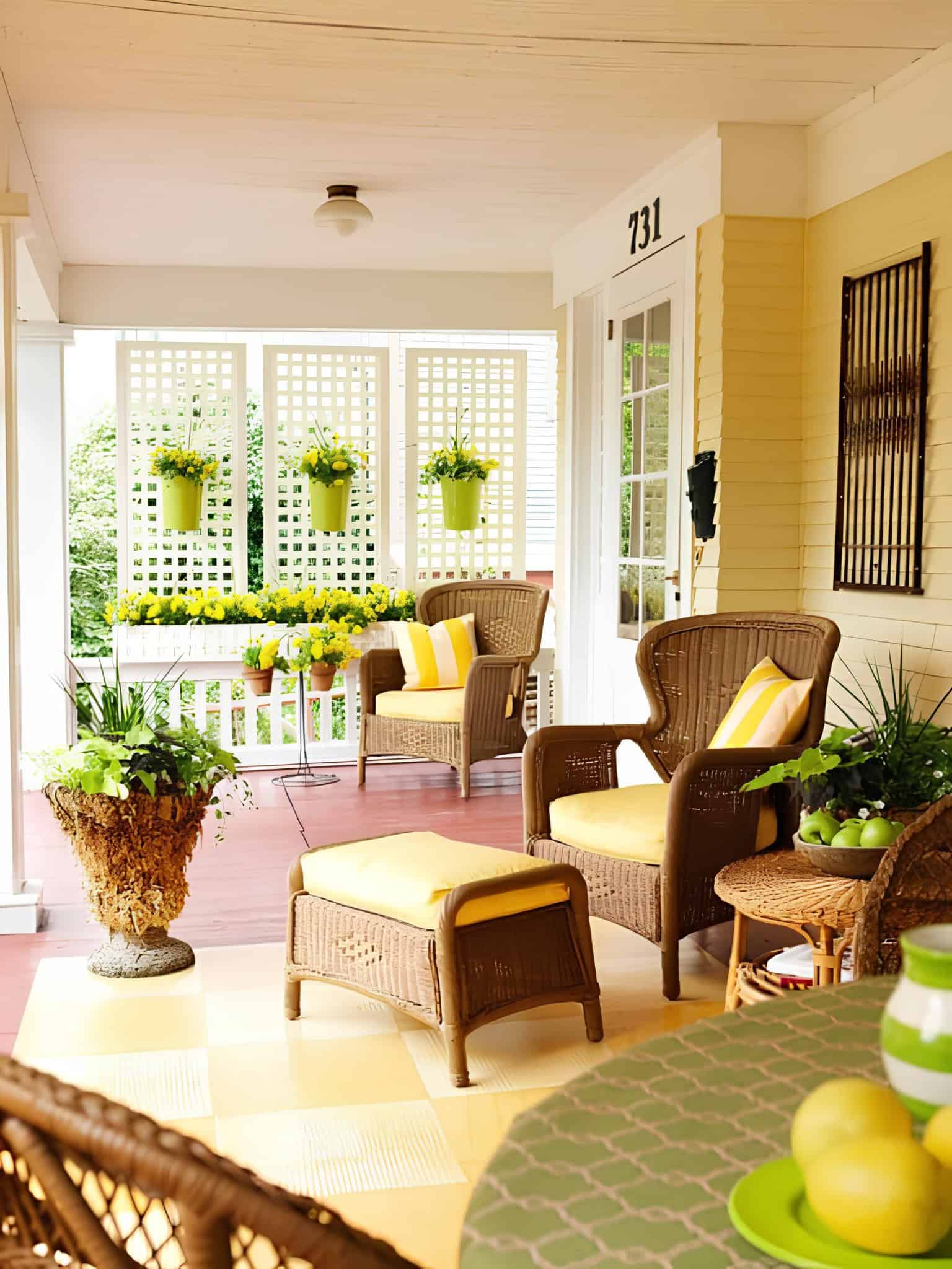 White lattice privacy panels with hanging flower pots on a cozy front porch