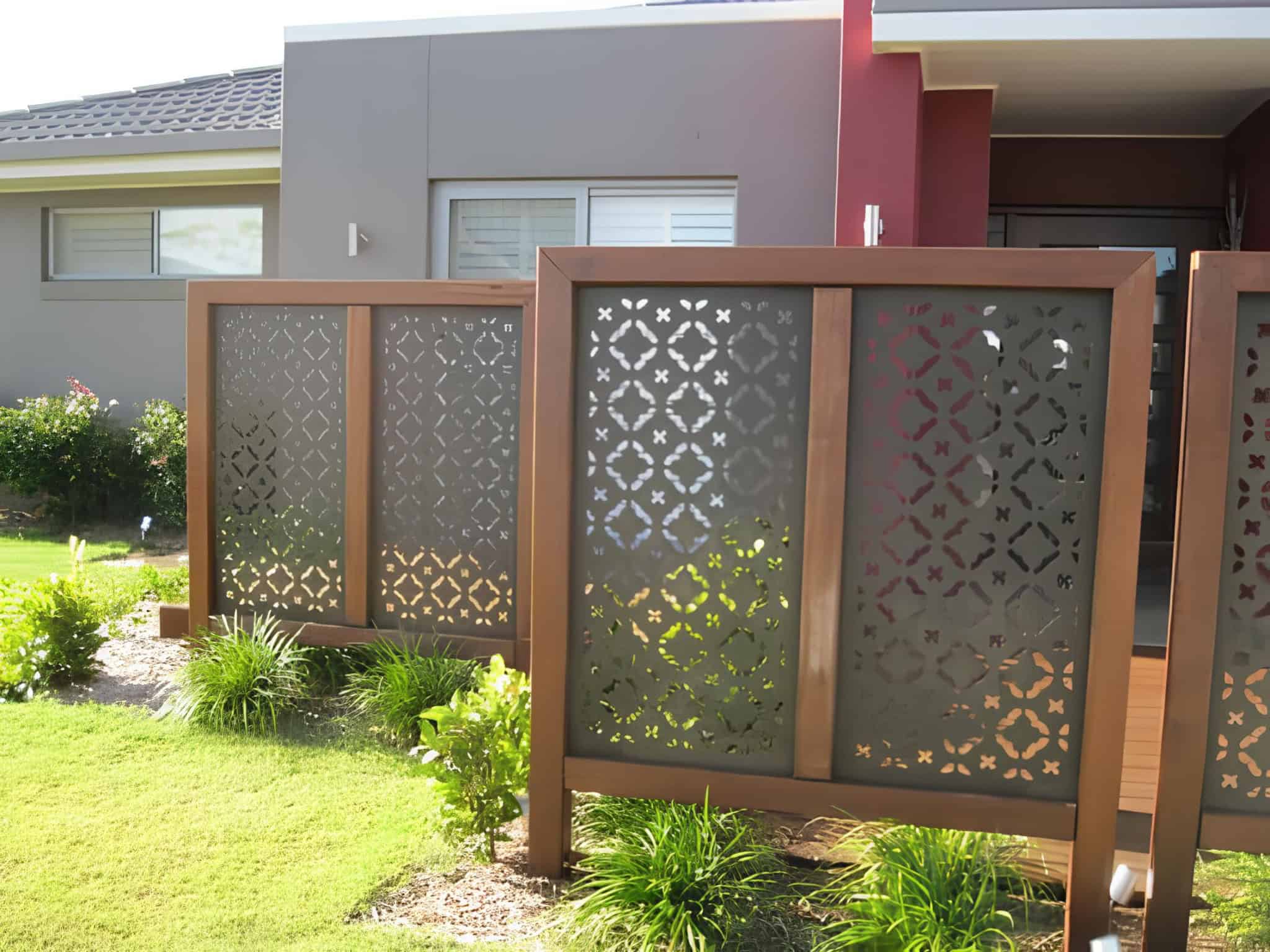 Contemporary metal privacy screen with intricate patterns for a modern front yard