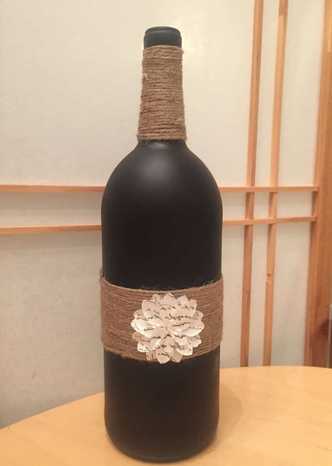 Recycled wine bottle black matte twine and flower Buy it on: www.etsy.com