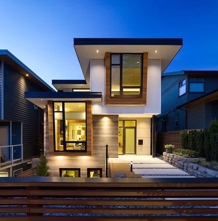 Contemporary modern house exterior with sleek architectural design, large windows, and stylish lighting at dusk.